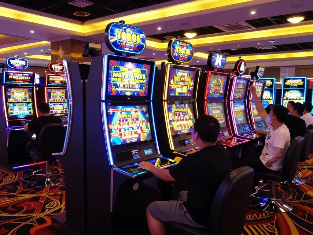 Slot Malaysia players celebrating wins in a colorful casino environment.